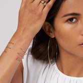 Three Cuff Bracelets on woman's wrist